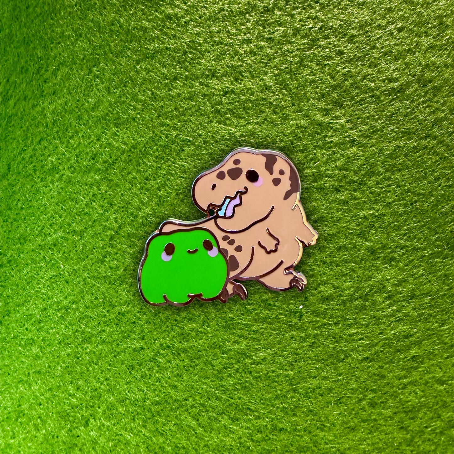 dinosaur x frog pin